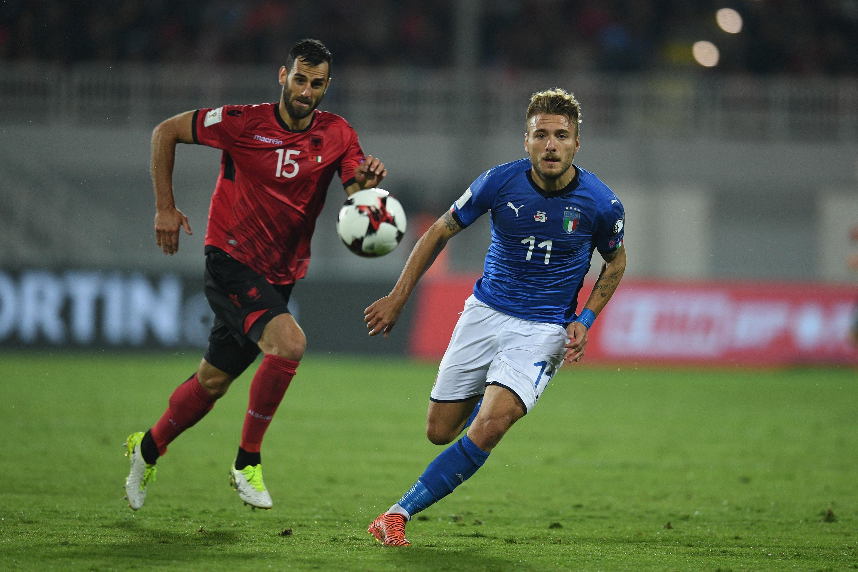 SHKODER, ALBANIA - OCTOBER 09: Ciro Immobile of Italy (R) competes for the ball with Mergim Mavraj of Albania during the FIFA 2018 World Cup Qualifier between Albania and Italy at Loro Borici Stadium on October 9, 2017 in Shkoder, Albania.  (Photo by Claudio Villa/Getty Images)