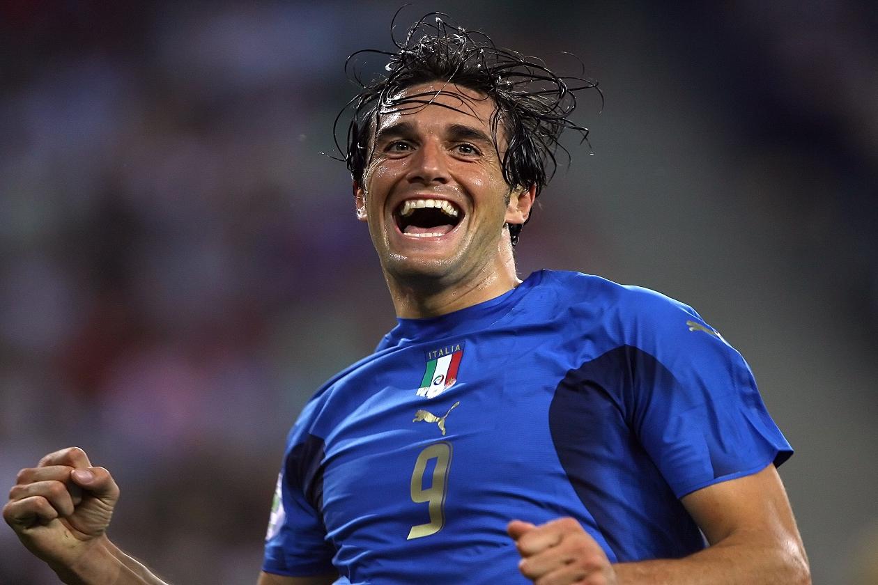 Italian forward Luca Toni celebrates after scoring the second goal for his team during the World Cup 2006 quarter final football game Italy vs. Ukraine, 30 June 2006 at Hamburg stadium. AFP PHOTO / PATRICK HERTZOG (Photo credit should read PATRICK HERTZOG/AFP/Getty Images)