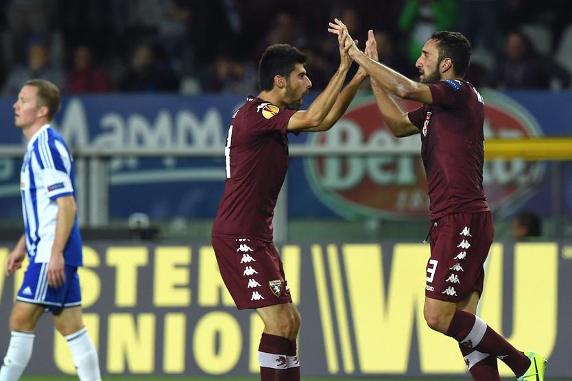 TURIN, ITALY - OCTOBER 23:  Cristian Molinaro (R) of Torino FC celebrates after scoring the opening goal with team-mates Marco Benassi during the UEFA Europa League group B match between Torino FC and HJK Helsinki at Olimpico stadium on October 23, 2014 in Turin, Italy.  (Photo by Valerio Pennicino/Getty Images)