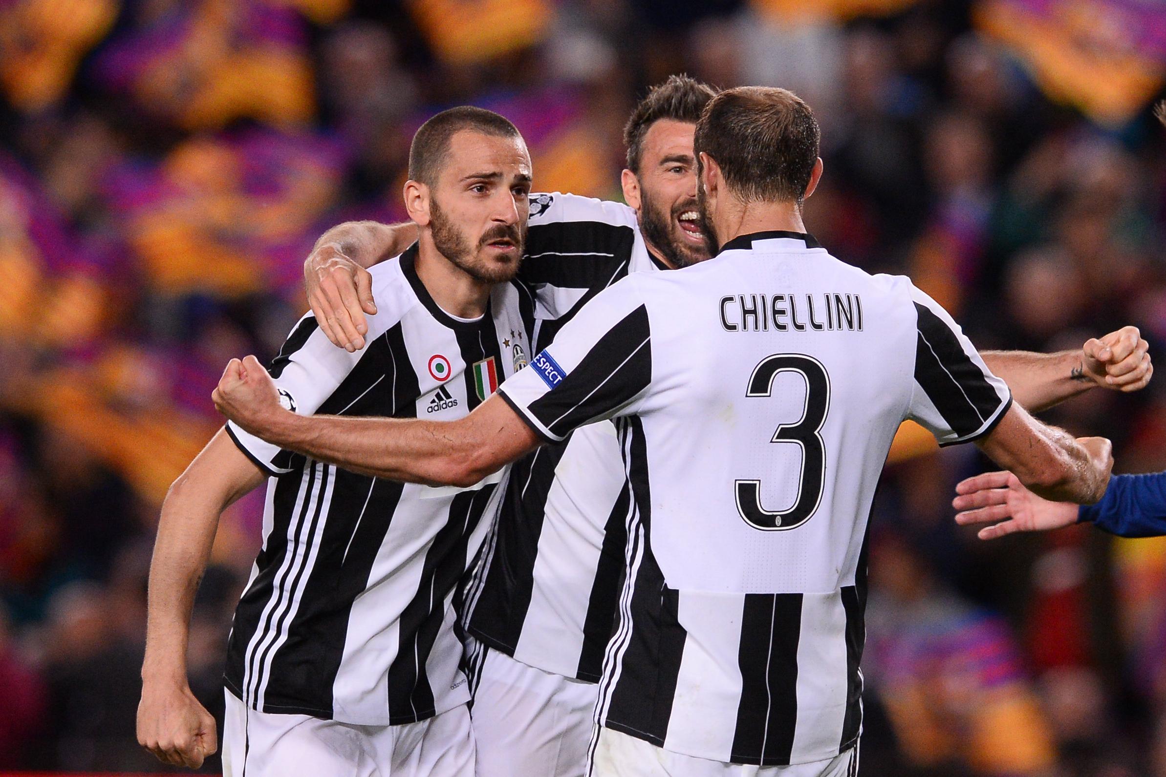 Juventus\\' defender Giorgio Chiellini (R) celebrates their qualification with teammates at the end of the UEFA Champions League quarter-final second leg football match FC Barcelona vs Juventus at the Camp Nou stadium in Barcelona on April 19, 2017. / AFP PHOTO / Josep LAGO        (Photo credit should read JOSEP LAGO/AFP/Getty Images)