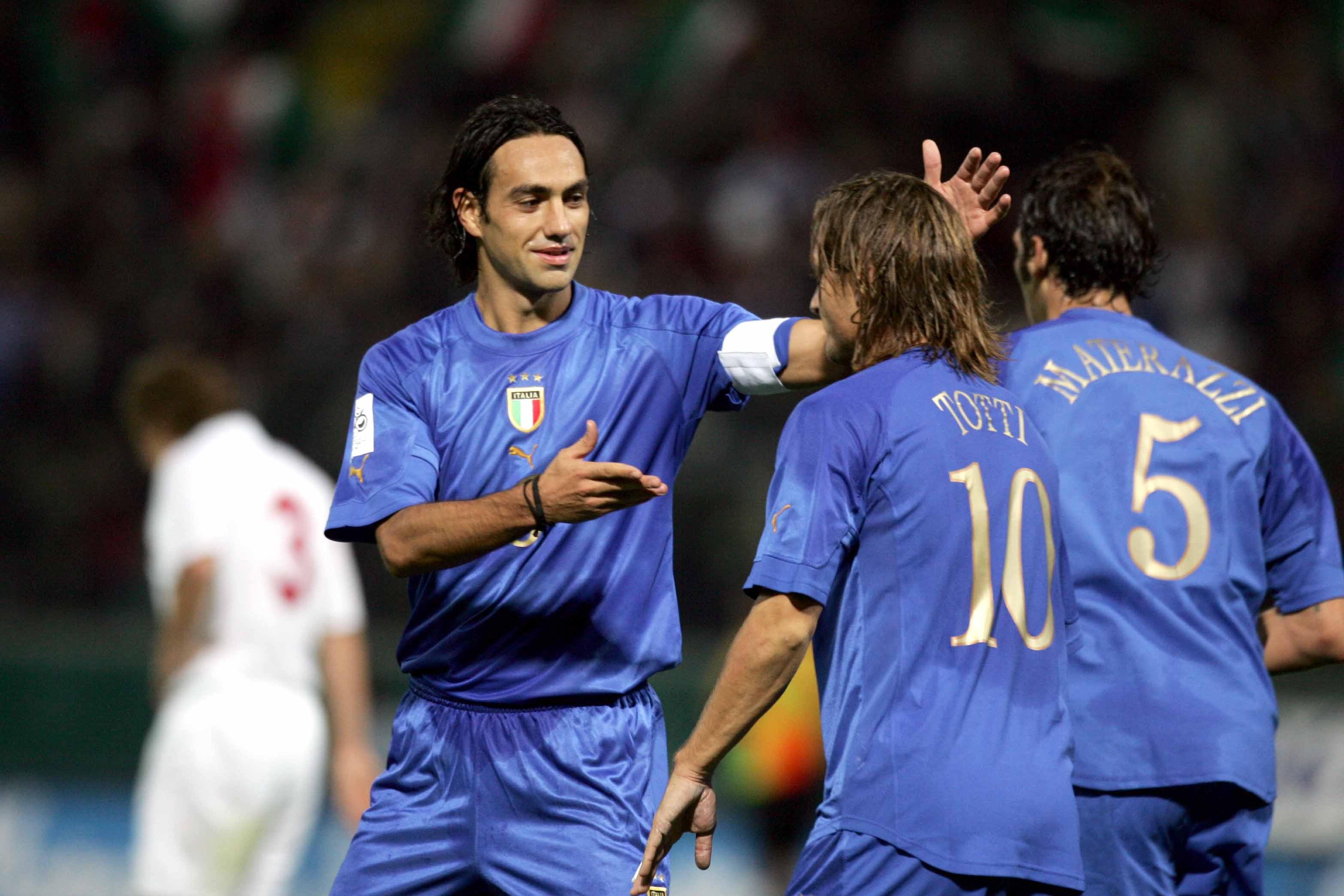 PARMA, ITALY - OCTOBER 13: Alessandro Nesta and Francesco Totti celebrate goal during the World Cup 2006 qualifying football match between Italy and Belarus at Ennio Tardini Stadium on October 13, 2004 in Parma, Italy.  (Photo by FIGC Sabattini/FIGC Sabattini)