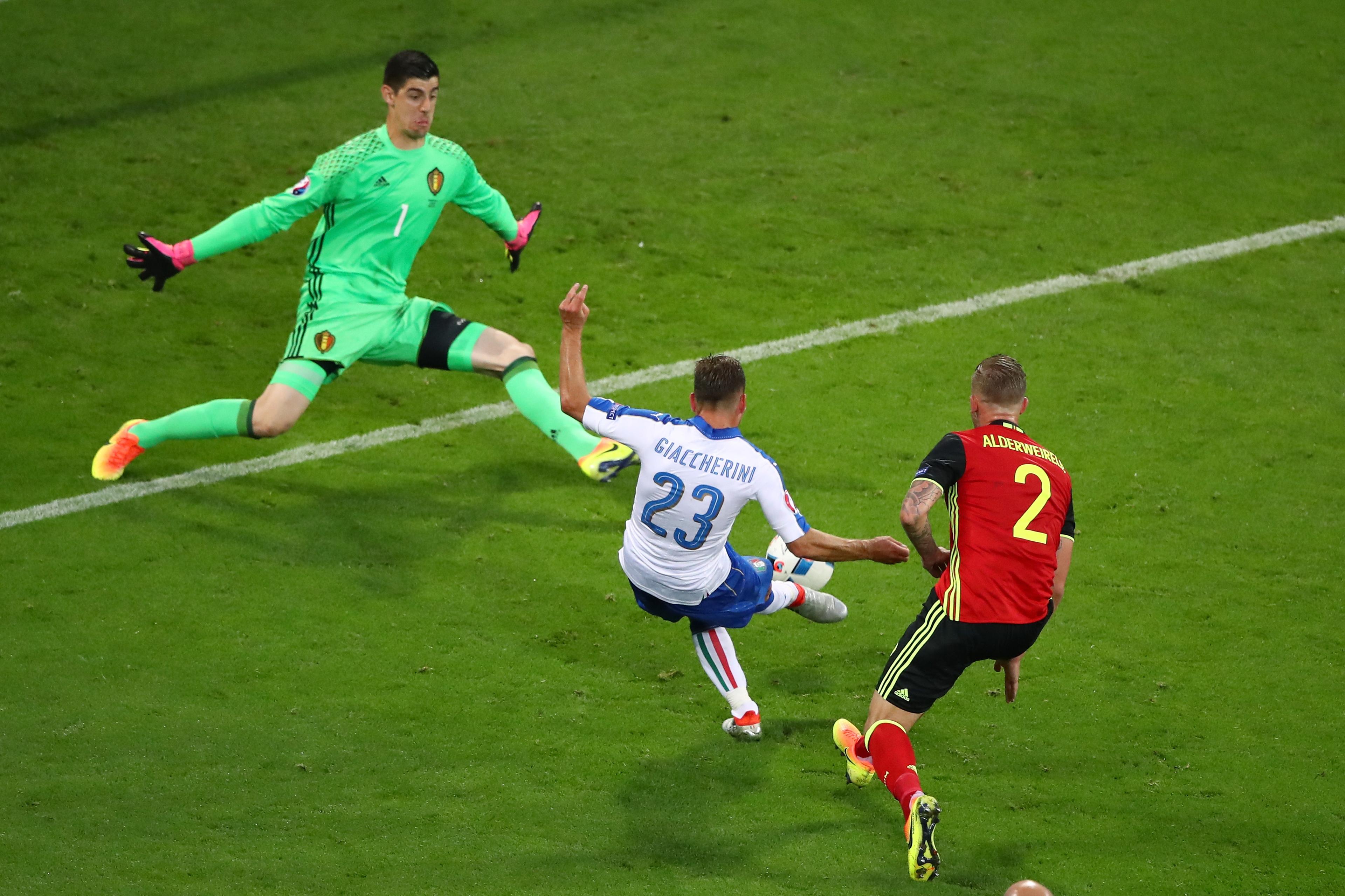 LYON, FRANCE - JUNE 13: Emanuele Giaccherini (C) of Italy scores his team's first goal past Thibaut Courtois (L) of Belgium during the UEFA EURO 2016 Group E match between Belgium and Italy at Stade des Lumieres on June 13, 2016 in Lyon, France. (Photo by Clive Brunskill/Getty Images)
