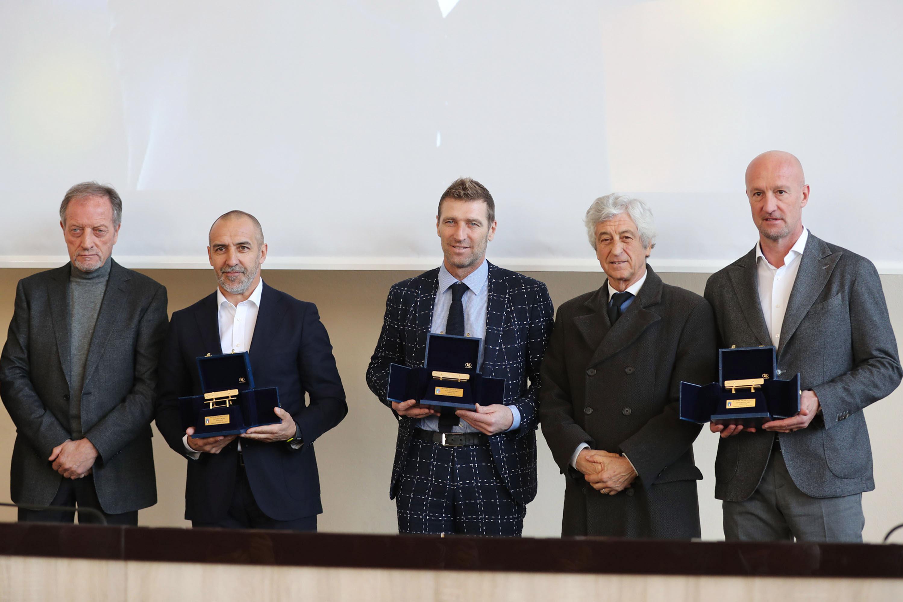 FLORENCE, ITALY - MARCH 26: Roberto Bordin, Massimo Carreca and Marco Rossi receive the \"Golden Bench\" award for coaches who have won abroad during the Italian Football Federation \\'Panchine D\\'Oro E D\\'Argento\\' Prize at Coverciano on March 26, 2018 in Florence, Italy.  (Photo by Gabriele Maltinti/Getty Images)