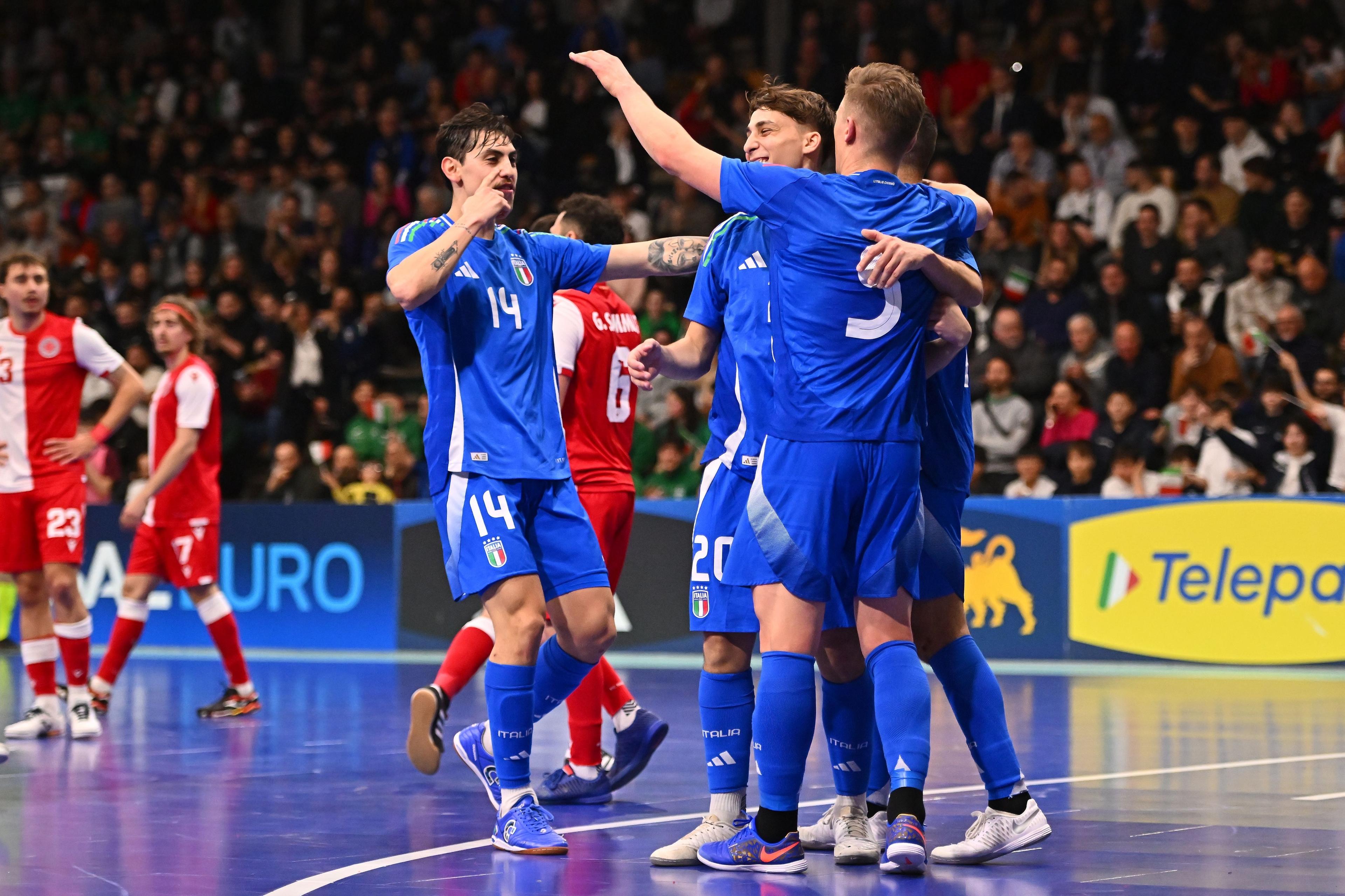 REGGIO NELL'EMILIA, ITALY - MARCH 06:Italian players celebrate after scoring a goal during the UEFA Futsal EURO 2026 Qualifying Round match between Italy and Malta on March 06, 2025 in Reggio nell'Emilia, Italy. (Photo by FIGC/FIGC via Getty Images)