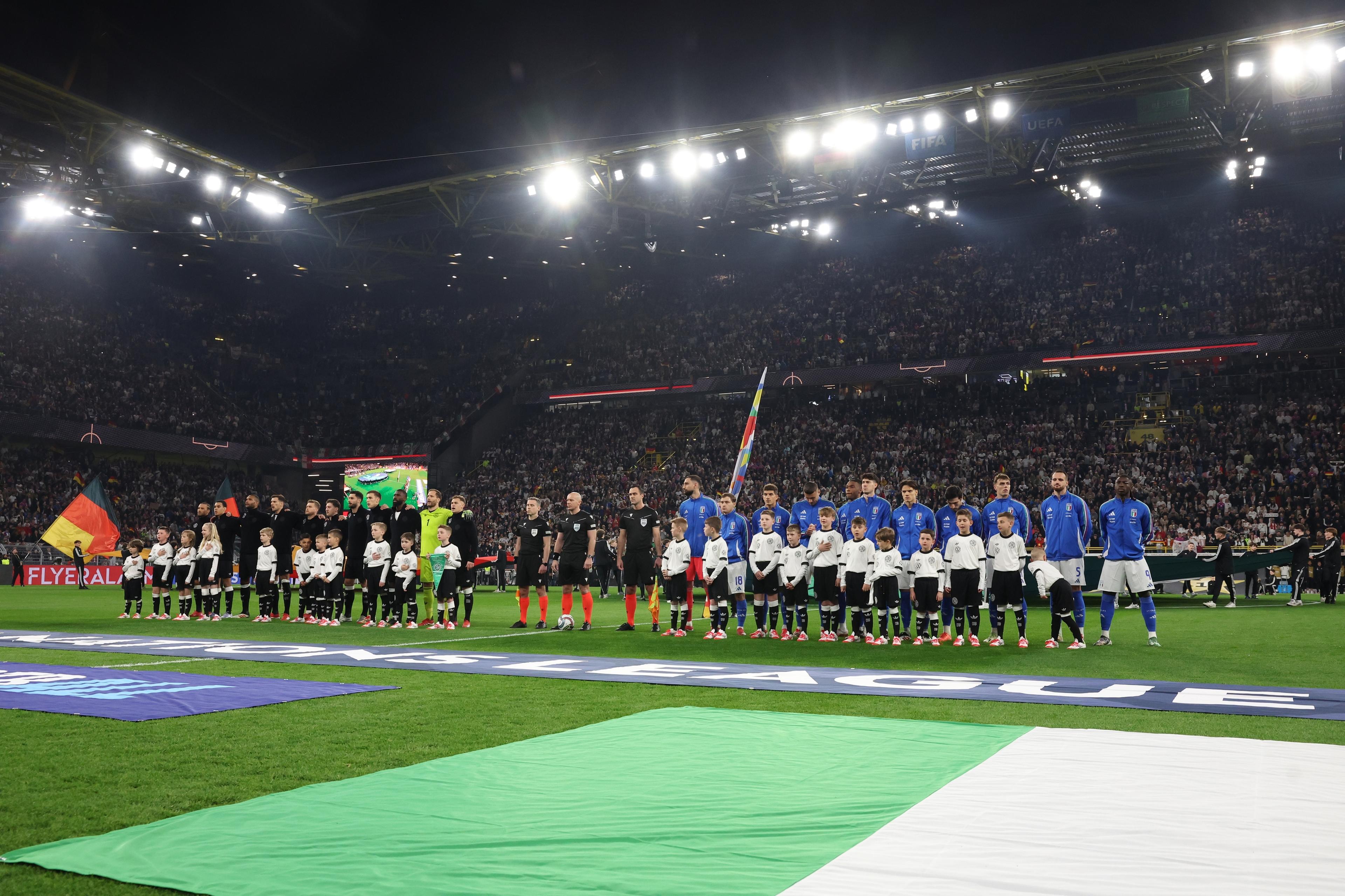 DORTMUND, GERMANY - MARCH 23: Players of Italy line up prior to the UEFA Nations League Quarterfinal Leg Two match between Germany and Italy at Football Stadium Dortmund on March 23, 2025 in Dortmund, Germany. (Photo by Claudio Villa - FIGC/FIGC via Getty Images)