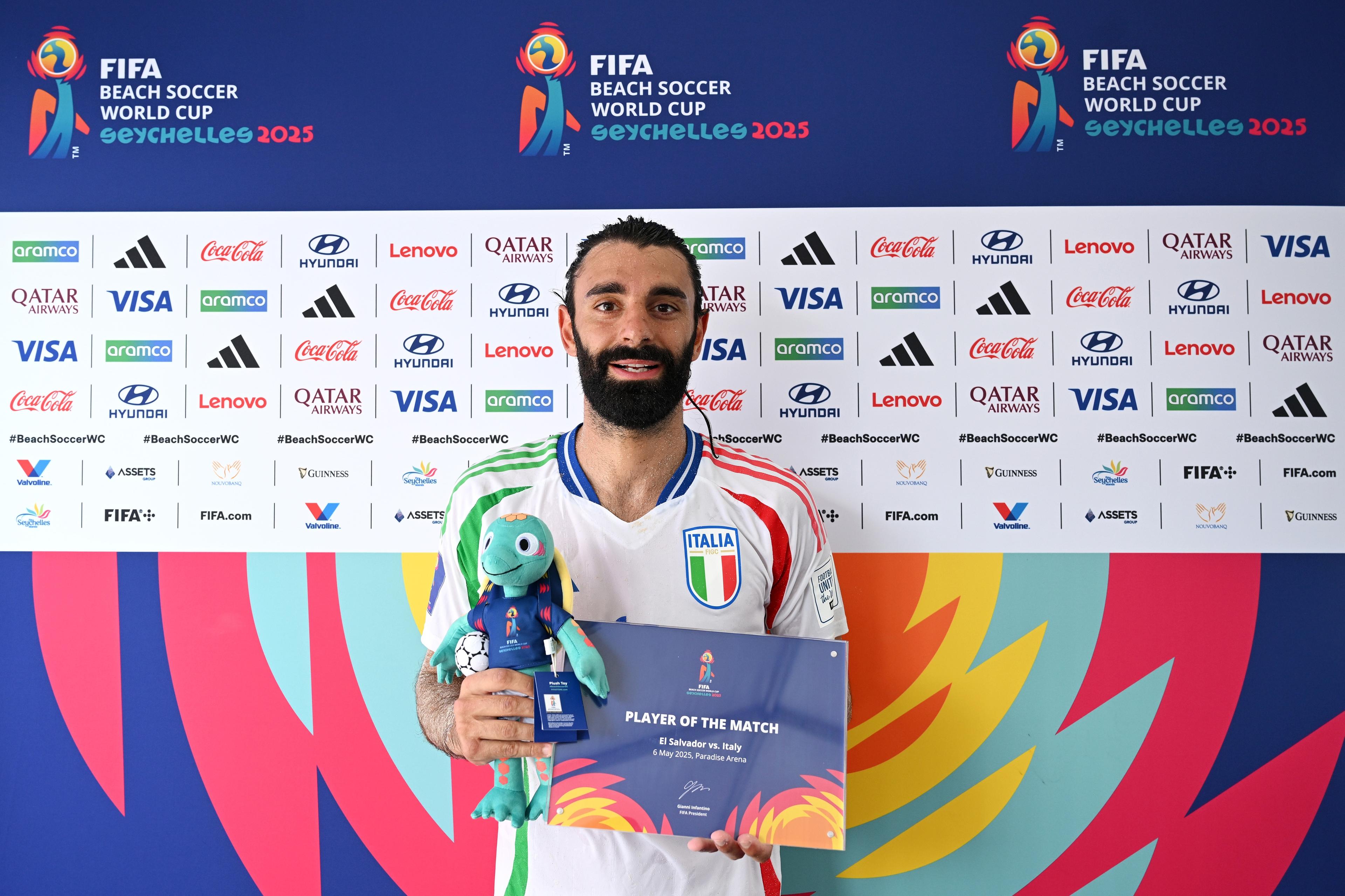 MAHE, SEYCHELLES - MAY 06: Gianmarco Genovali of Italy pose for a photo with his Player of the Match award after the team's victory in the FIFA Beach Soccer World Cup Seychelles 2025 Group D match between El Salvador and Italy at The Paradise Arena on May 06, 2025 in Mahe, Seychelles. (Photo by Tullio Puglia - FIFA/FIFA via Getty Images)