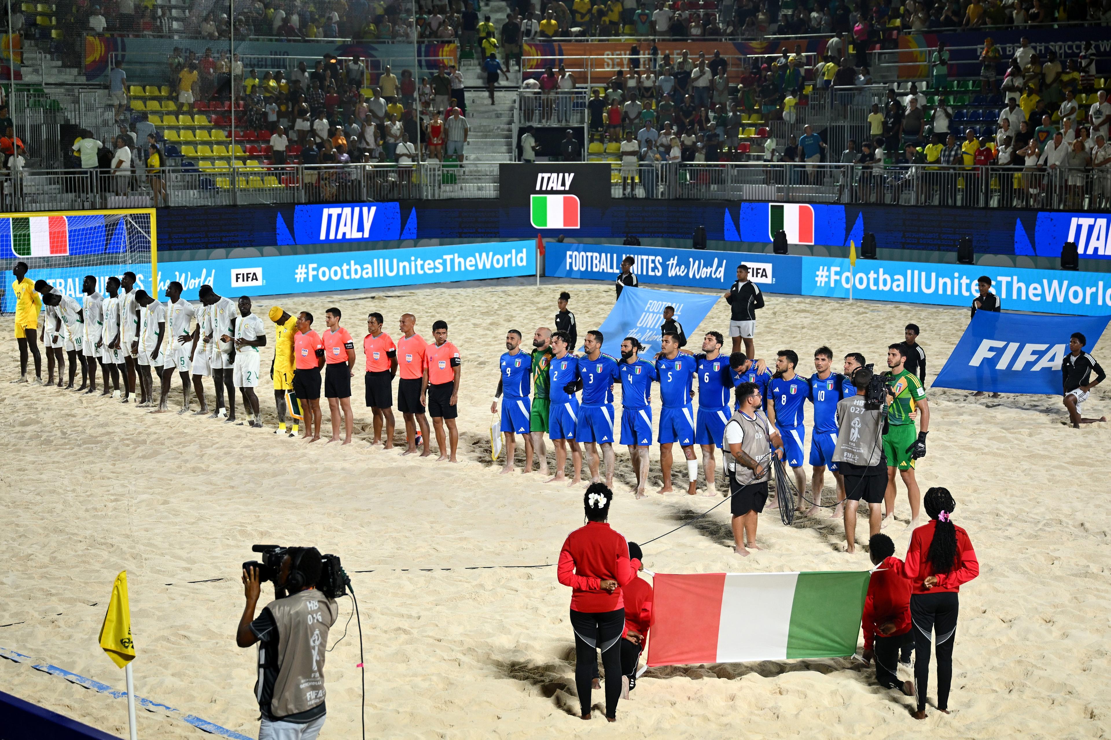 MAHE, SEYCHELLES - MAY 08: Players of Italy sing the national anthem prior to the FIFA Beach Soccer World Cup Seychelles 2025 Quarter-Final match between Senegal and Italy at The Paradise Arena on May 08, 2025 in Mahe, Seychelles. (Photo by Tullio Puglia - FIFA/FIFA via Getty Images)