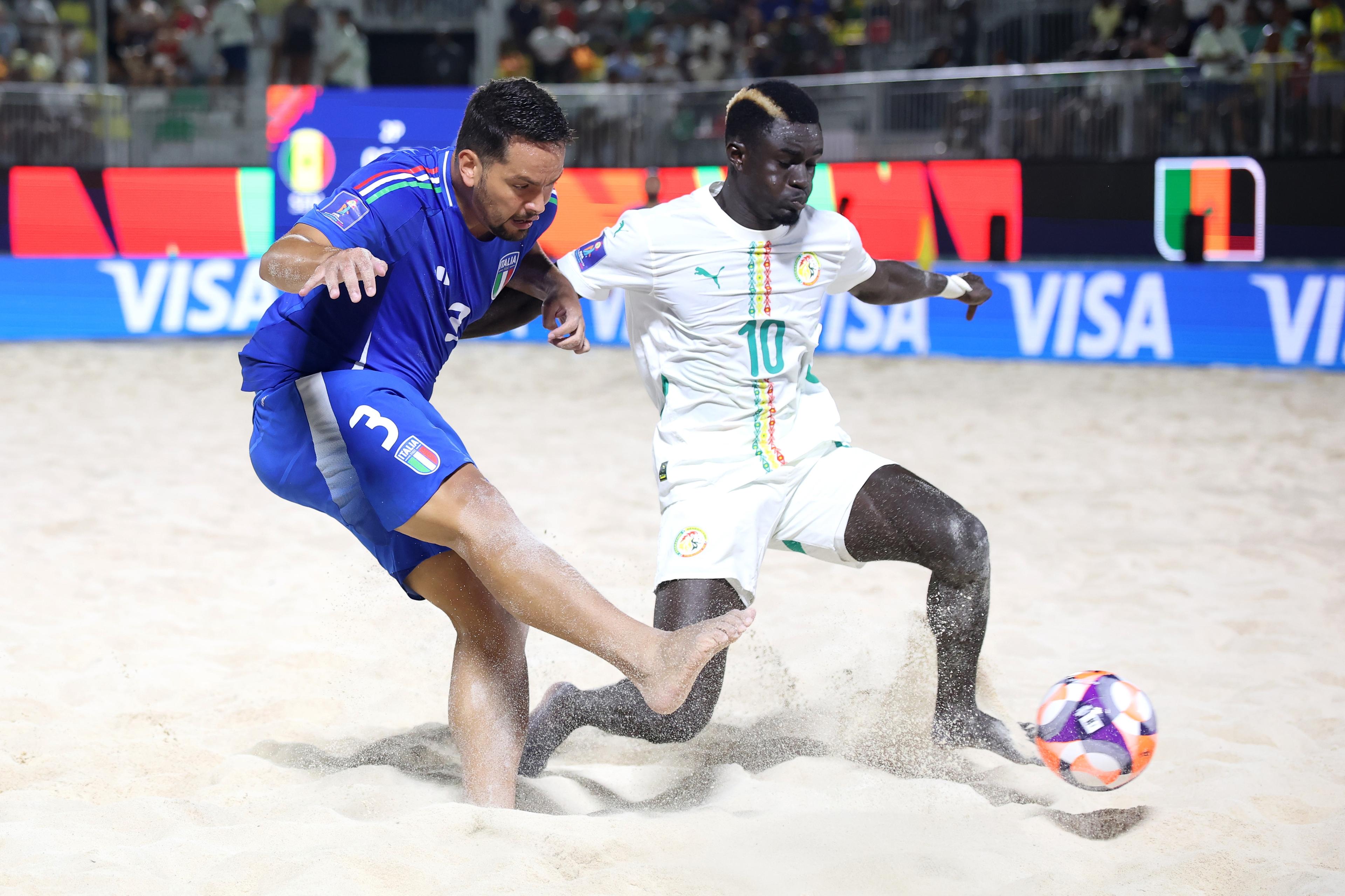 MAHE, SEYCHELLES - MAY 08: Camillo Marchesi of Italy shoots whilst under pressure from Mamour Diagne of Senegal during the FIFA Beach Soccer World Cup Seychelles 2025 Quarter-Final match between Senegal and Italy at The Paradise Arena on May 08, 2025 in Mahe, Seychelles. (Photo by Alex Grimm - FIFA/FIFA via Getty Images)