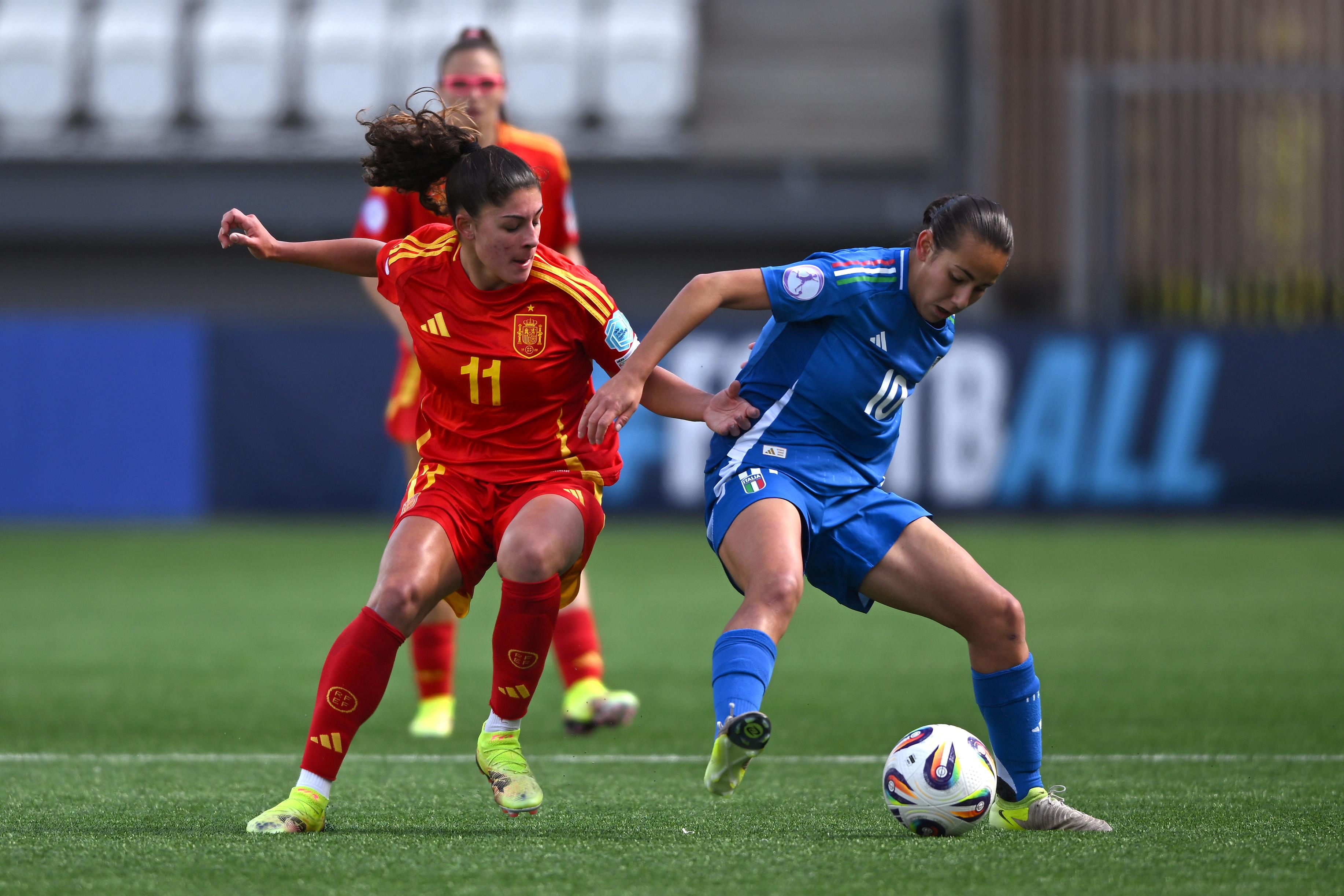 THORSHAVN, FAEROE ISLANDS - MAY 11: Anna Quer of Spain and Rachele Giudici of Italy compete for the ball during the UEFA Women's European Under-17 Championship 2024/25 Group B match between Italy and Spain at Torsvollur on May 11, 2025 in Thorshavn, Faeroe Islands. (Photo by Shauna Clinton/UEFA via Getty Images)