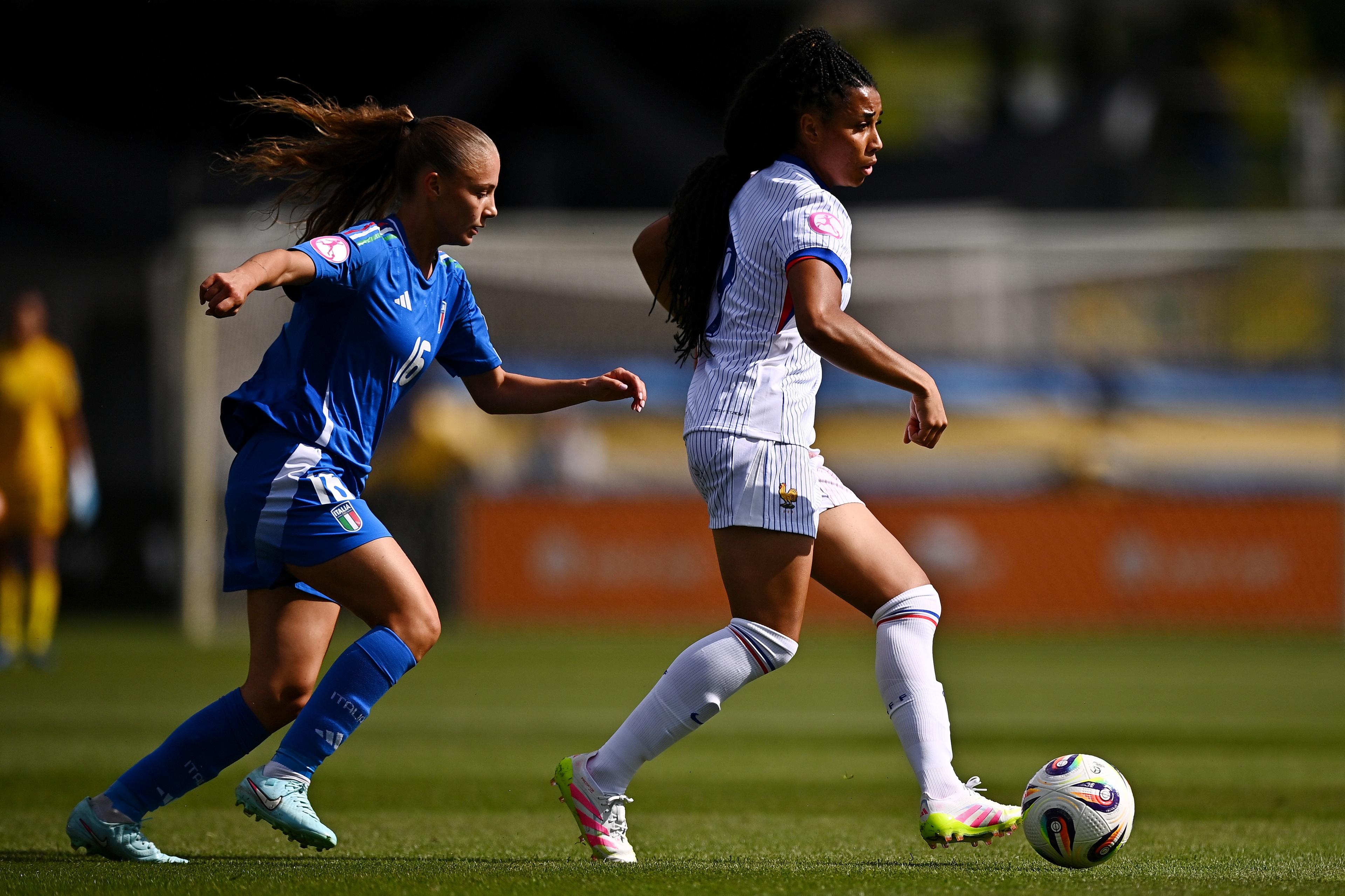 RZESZOW, POLAND - JUNE 21: Celia Chabod of France is runs ahead of Martina Cherubini of Italy during the UEFA Women's European Under-19 Championship 2024/25 Group A match between Italy and France at Stadium Rzeszow on June 21, 2025 in Rzeszow, Poland. (Photo by Tyler Miller - Sportsfile/UEFA via Getty Images)