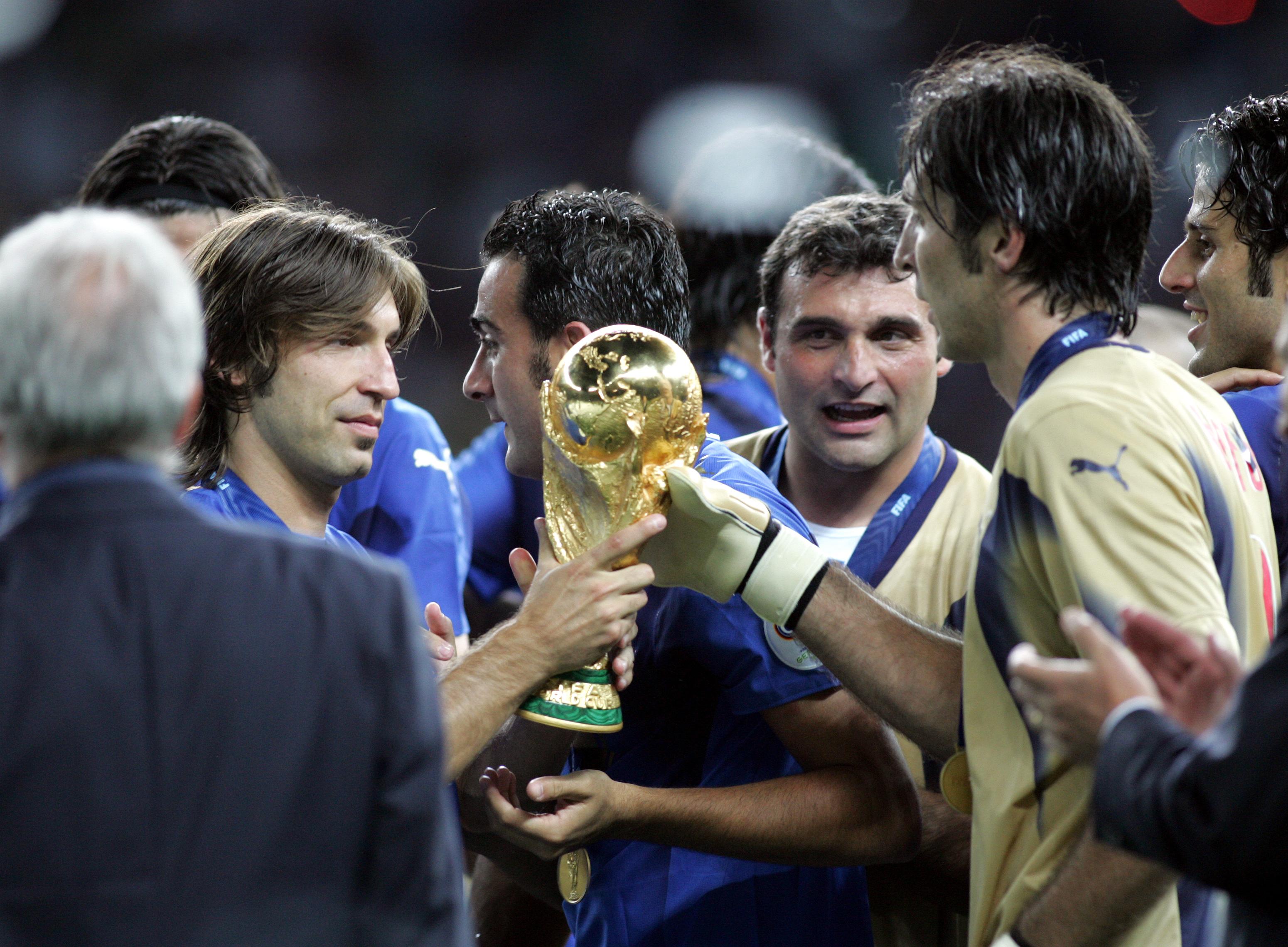 BERLIN, GERMANY - JULY 09: Andrea Pirlo Angelo Peruzzi and Gianluigi Buffon celebrate with the world cup trophy. following their team's during the FIFA World Cup Germany 2006 Final match between Italy and France at the Olympic Stadium on July 9, 2006 in Berlin, Germany. (Photo by FIGC/FIGC) *** Local Caption *** Andrea Pirlo;Angelo Peruzzi;Gianluigi Buffon
