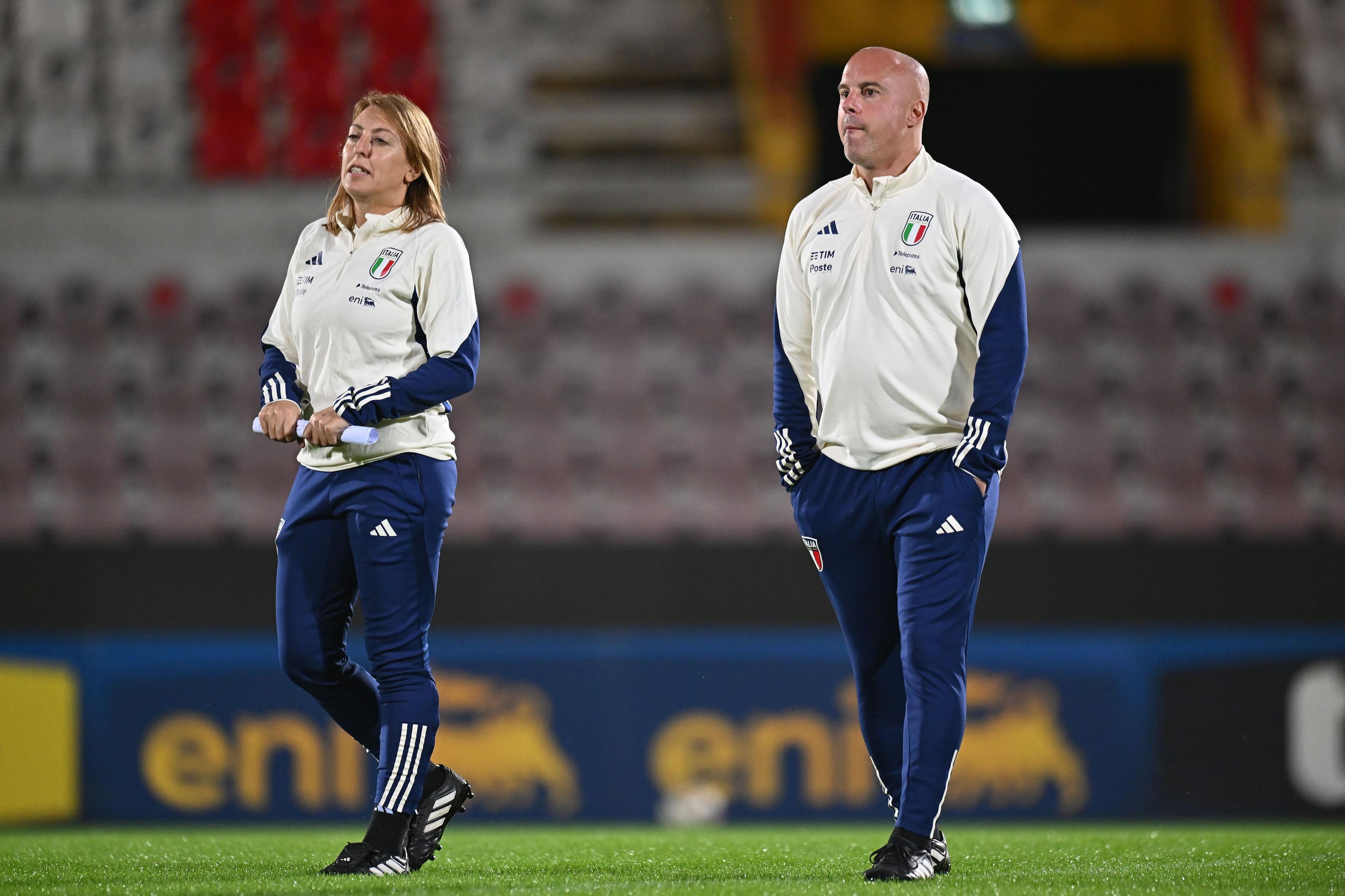 VICENZA, ITALY - OCTOBER 28:Andrea Soncin head coach of Italy and Viviana Schiavi during the Italy Women Training Session & Press Conference at Stadio Romeo Menti on October 28, 2024 in Vicenza, Italy. (Photo by FIGC/FIGC via Getty Images)