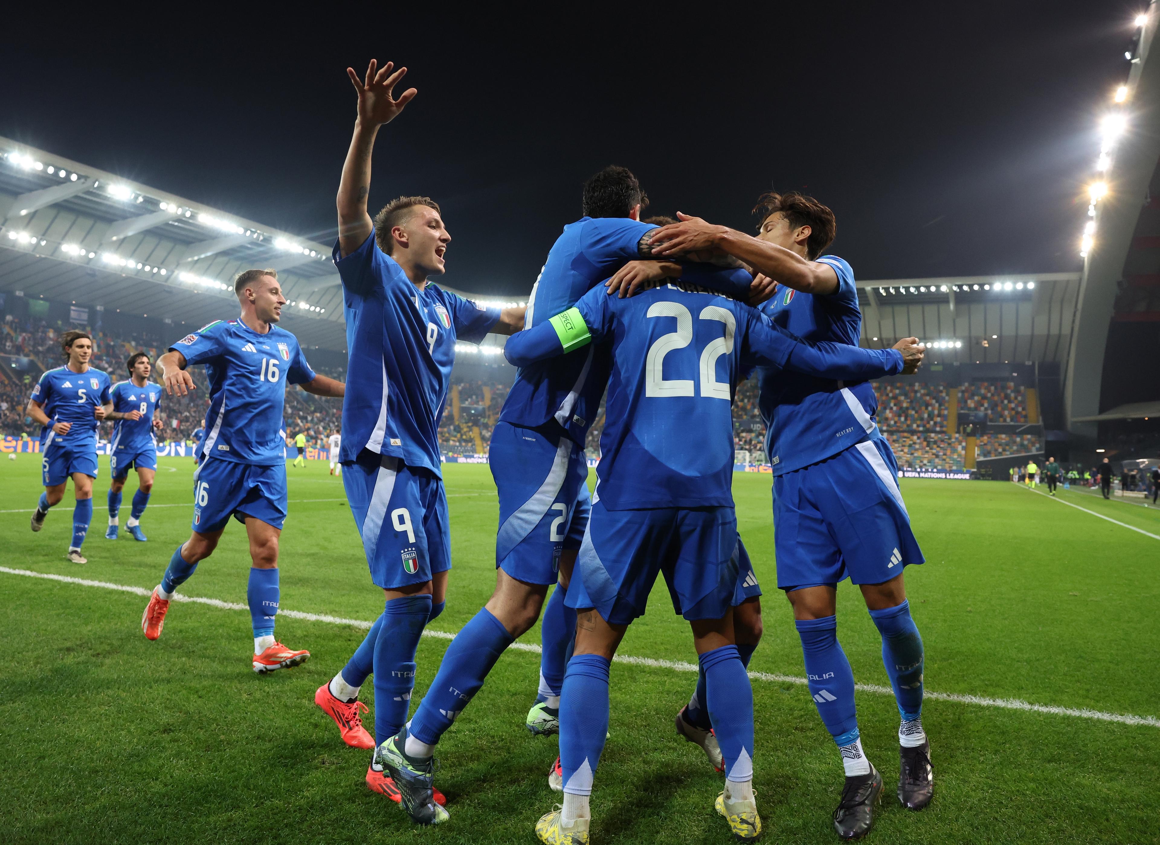 UDINE, ITALY - OCTOBER 14: Giovanni Di Lorenzo of Italy celebrates with team-mates after scoring the goal during the UEFA Nations League 2024/25 League A Group A2 match between Italy and Israel at on October 14, 2024 in Udine, Italy. (Photo by Claudio Villa - FIGC/FIGC via Getty Images)
