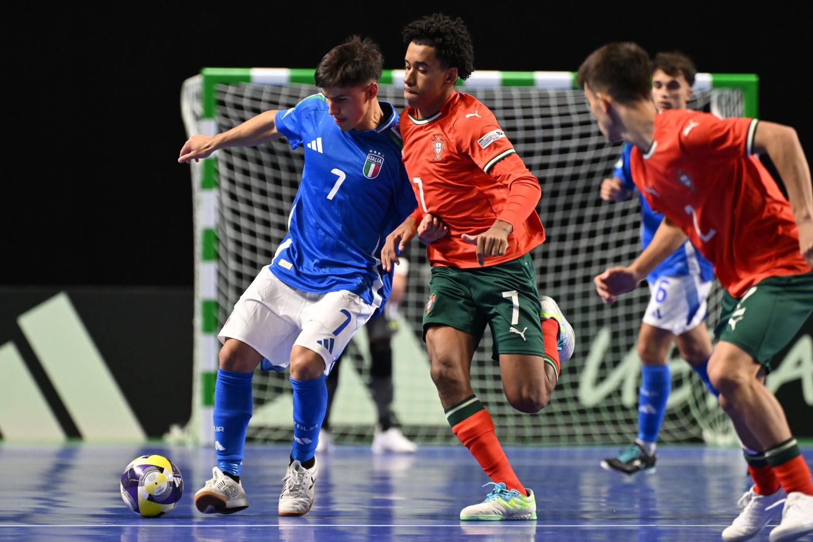 CHISINAU, MOLDOVA - SEPTEMBER 28: Mario Musumeci of Italy is challenged by Renato Fernandes Almeida of Portugal during the UEFA Under-19 Futsal Euro 2025 match between Portugal and Italy at Chisinau Arena on September 28, 2025 in Chisinau, Moldova. (Photo by Tullio Puglia - UEFA/UEFA via Getty Images)